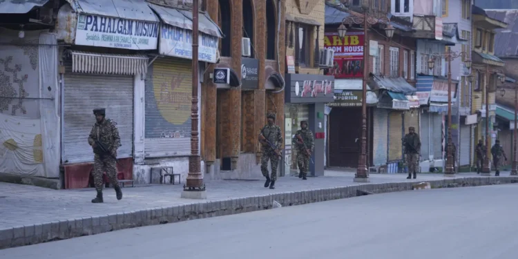 Indian security officers patrol a shopping area in Pahalgam a day after militants indiscriminately opened fire on tourists near the town, Indian controlled Kashmir, Wednesday, April 23, 2025. (AP Photo/Dar Yasin)