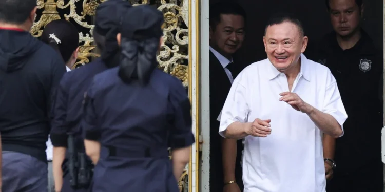 Former Thai Prime Minister Thaksin Shinawatra smiles as he walks out from Klong Prem Central Prison in Bangkok on Monday. Photo: Reuters