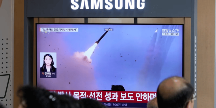 A TV screen shows a file image of a North Korean missile launch during a news program at Seoul, South Korea. -AP